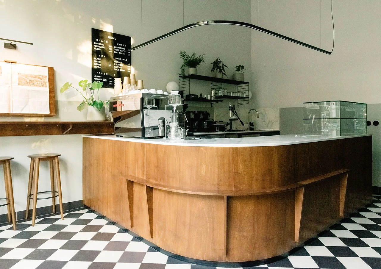 Zacharias — Curved wooden coffee counter