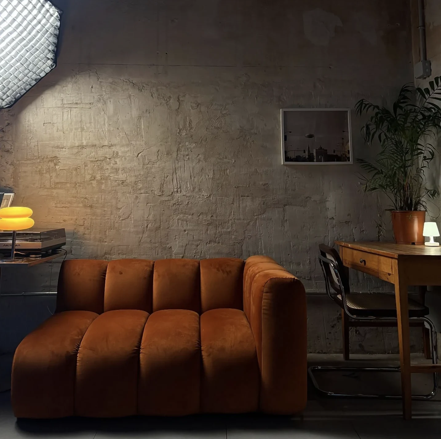 Casa Victoria — Warm brown sofa in the café